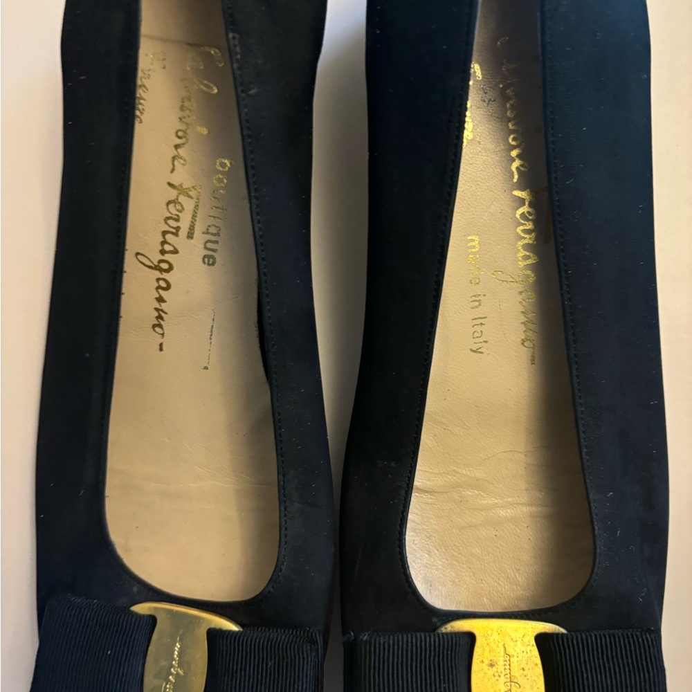 Salvatore Ferragamo 
Black Flats with Gold Accent